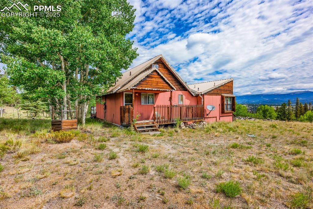 Image 3 of 33: Back of house featuring a deck