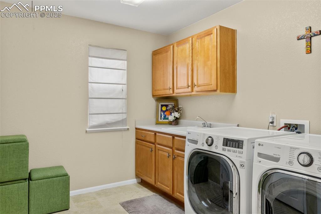 Image 18 of 38: Main floor laundry and mud room with garage access 