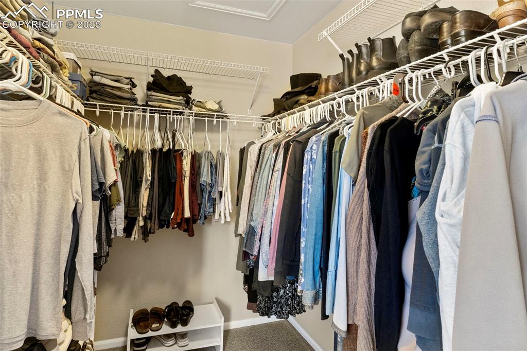 Image 25 of 38: primary suite walk-in closet