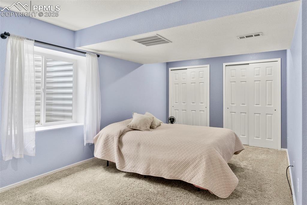 Image 32 of 38: oversized downstairs bedroom 