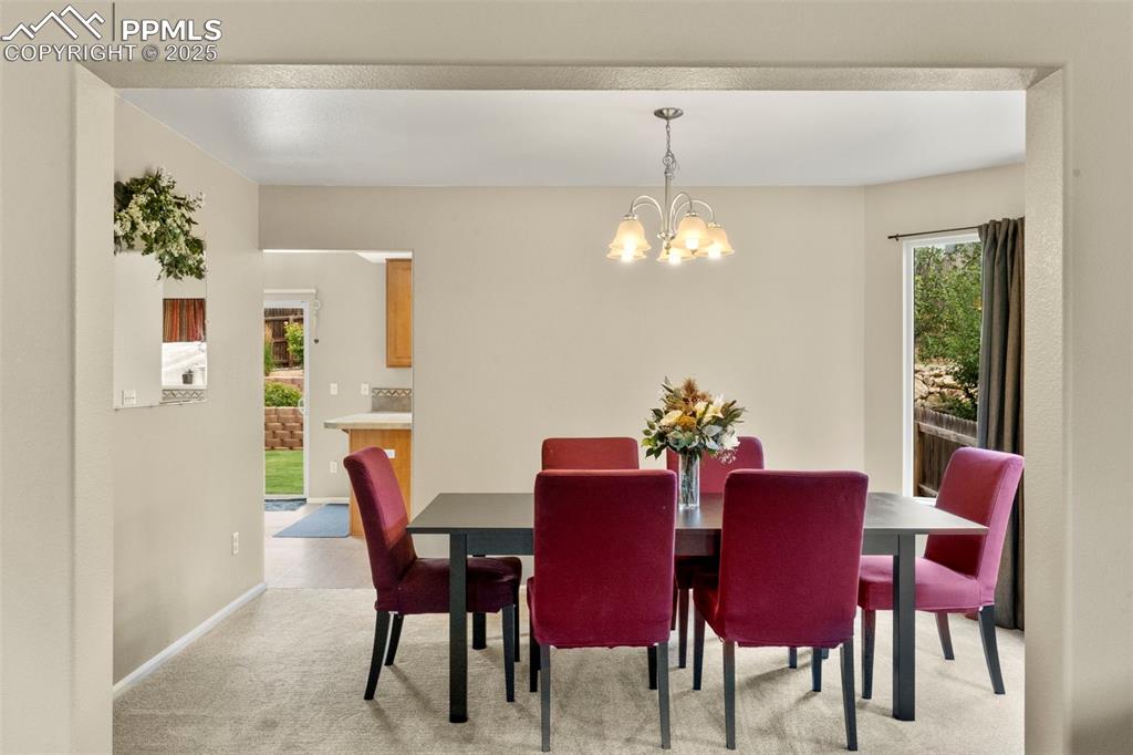 Image 9 of 38: Dining room that connects the sitting/living room and kitchen 