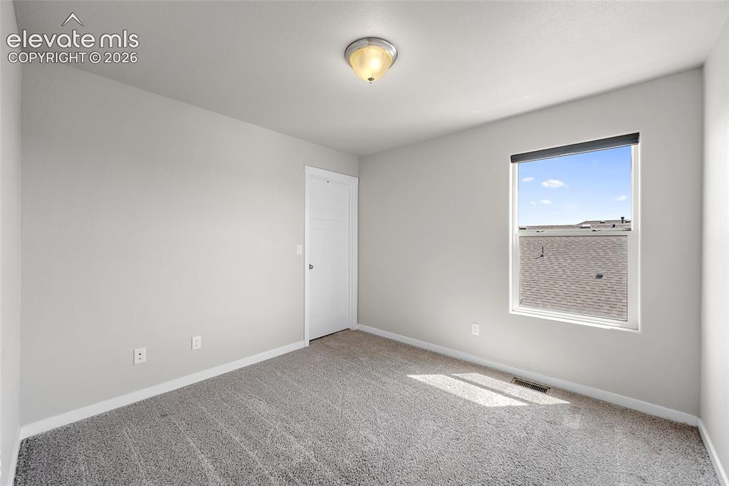 Image 18 of 48: Upper level bedroom #1.