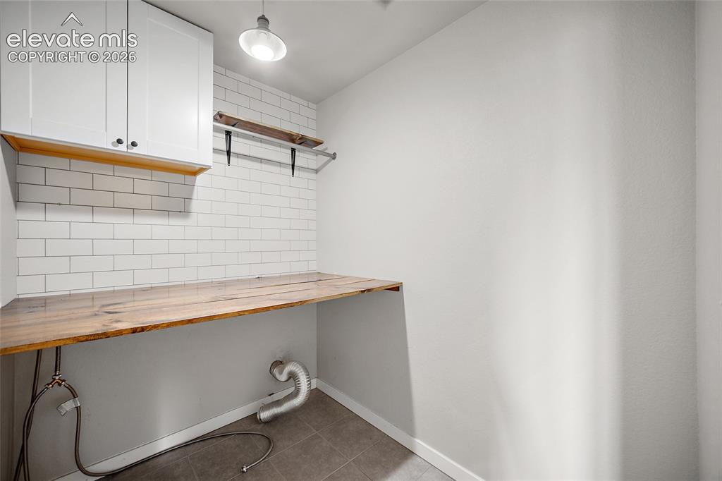 Image 24 of 48: Upper level laundry room.