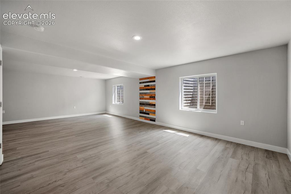 Image 31 of 48: Lower level family room.