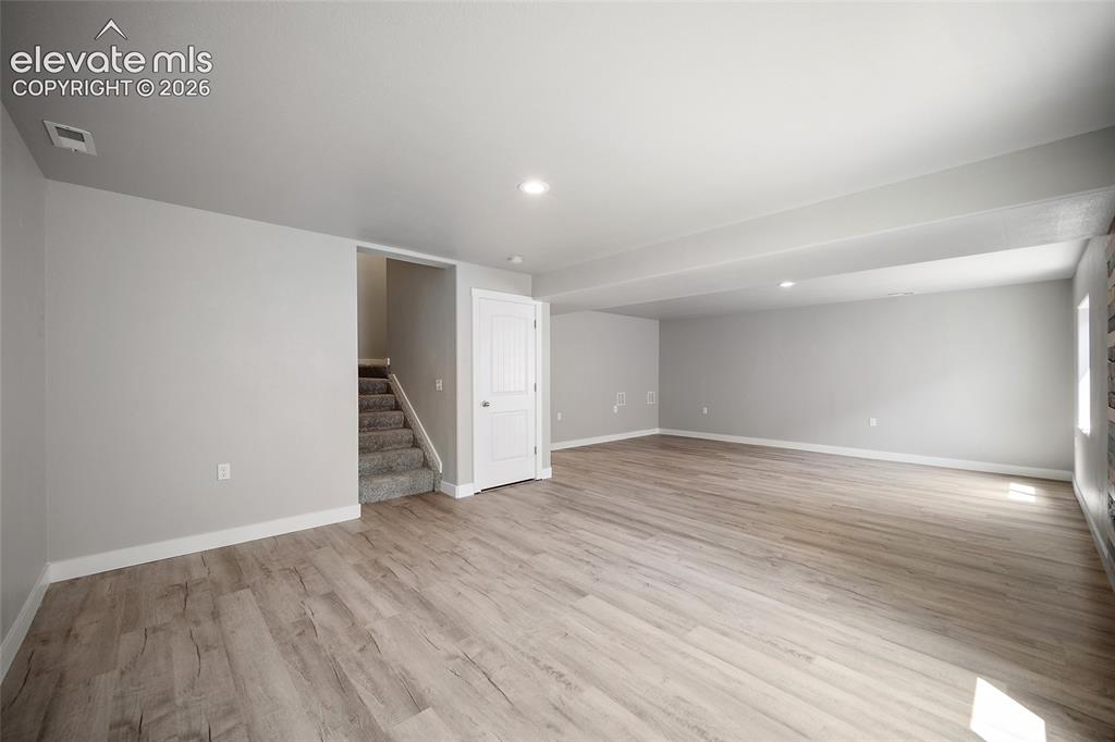 Image 32 of 48: Lower level family room.