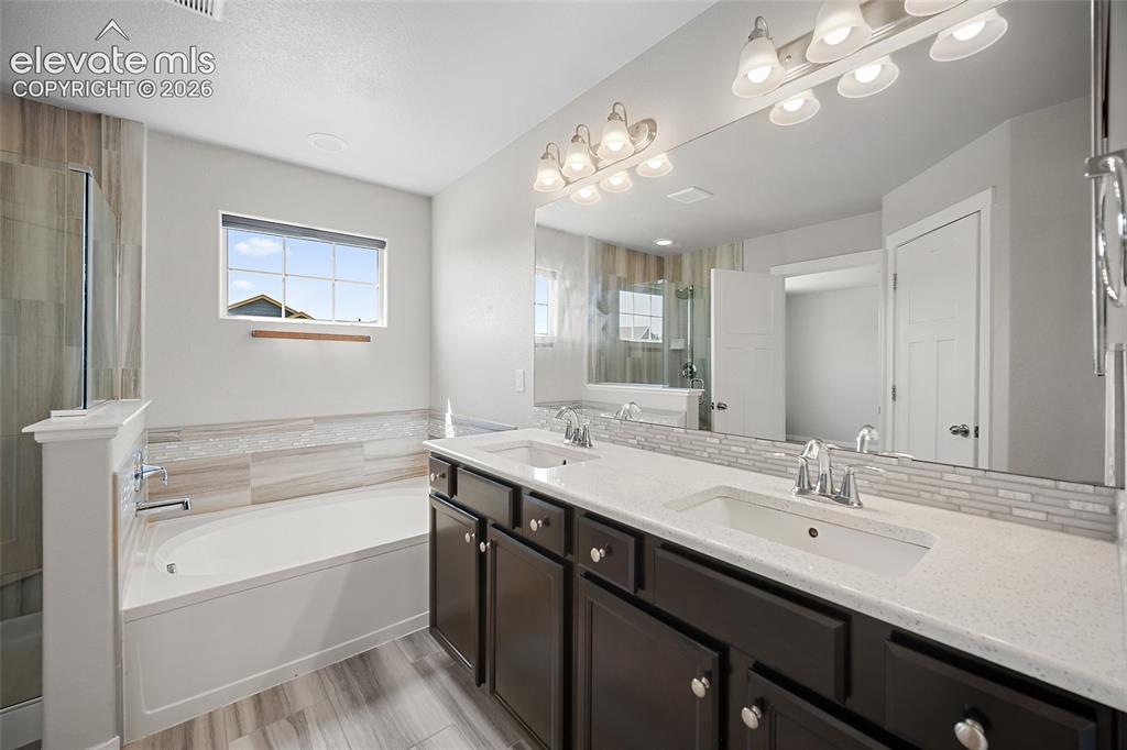 Image 4 of 48: 5 piece primary bathroom.