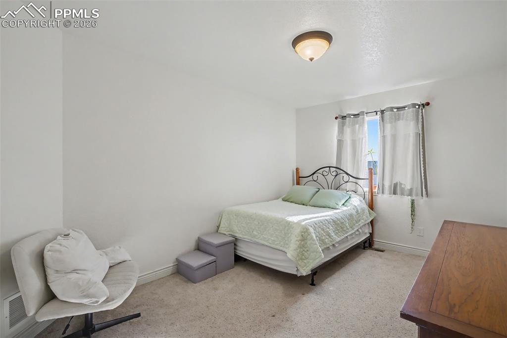 Image 32 of 49: Upstairs Bedroom with walk-in closet
