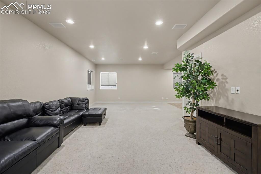 Image 34 of 49: Large family room/rec room in basement