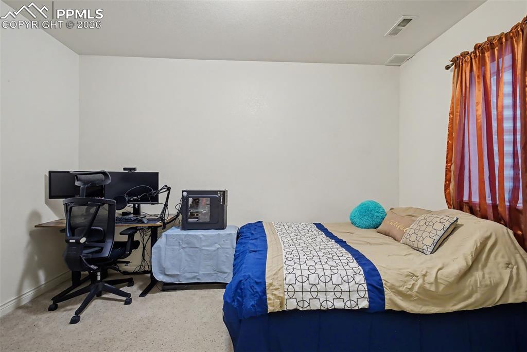 Image 42 of 49: Basement Bedroom