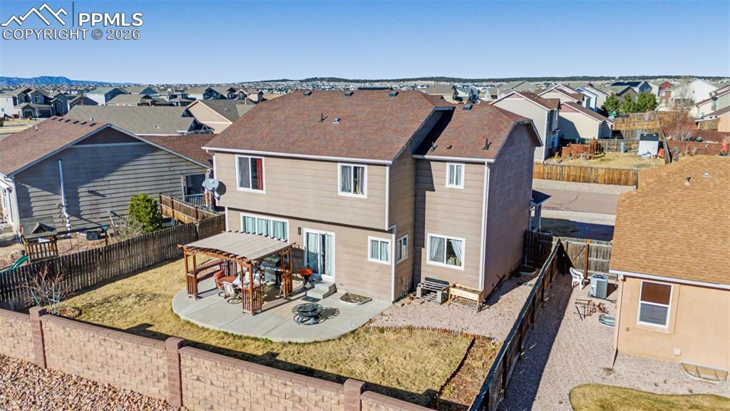 Image 47 of 49: Ariel of fully landscaped, private back yard