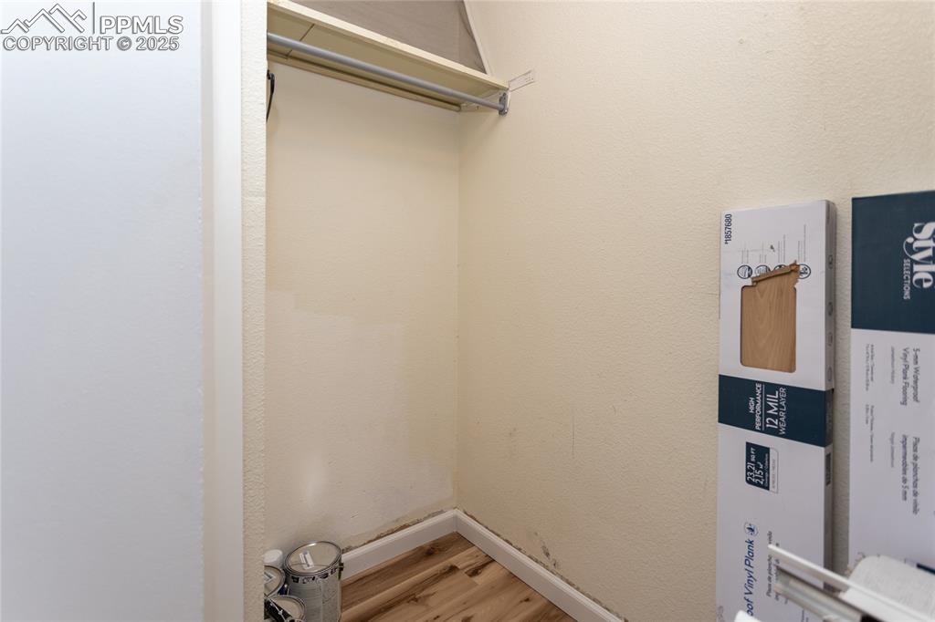 Image 12 of 27: Coat closet and storage area extends under the staircase.