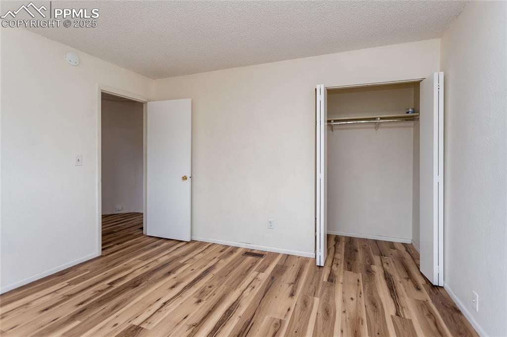 Image 18 of 27: Extra deep closet in the Primary Bedroom.