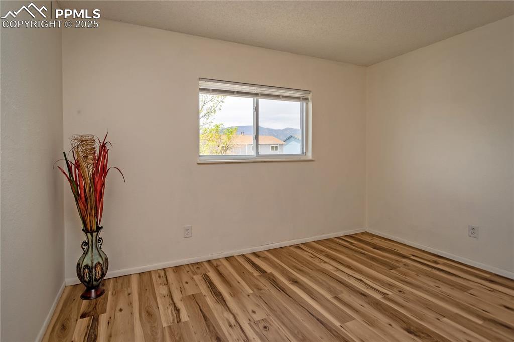 Image 19 of 27: Primary bedroom has views of the Cheyenne Mountain and the Front Range!
