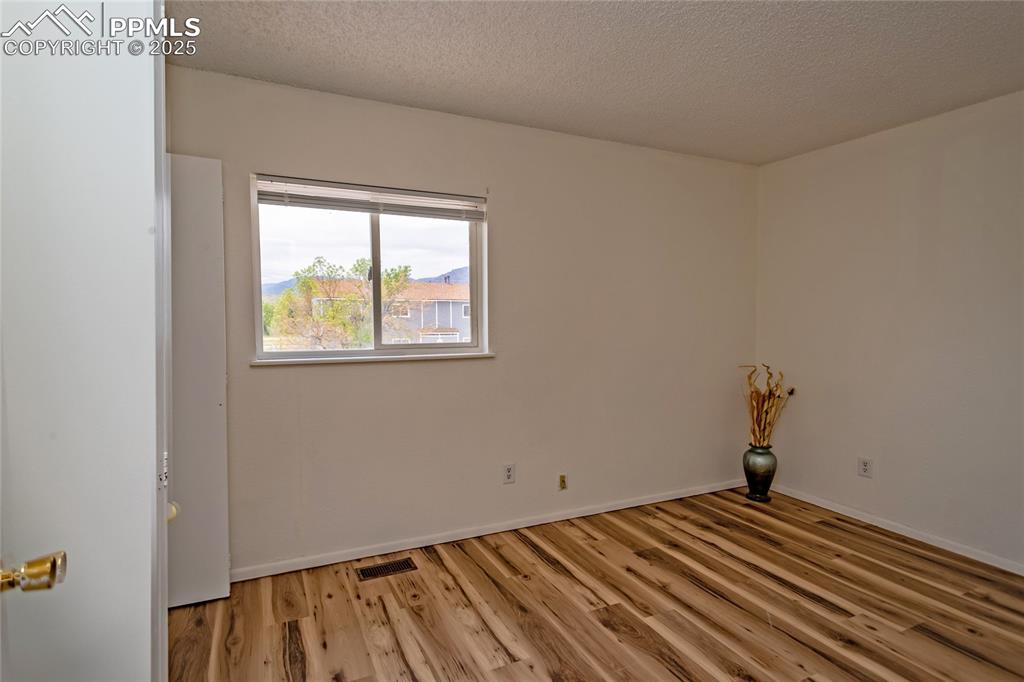 Image 21 of 27: Bedroom #2 also has Cheyenne Mountain and Front Range views!