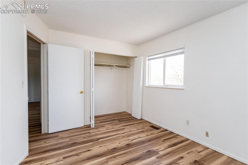 Image 22 of 27: New wood laminate flooring extends through the second level.