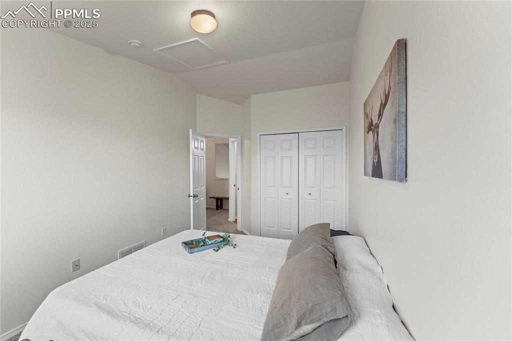 Image 21 of 22: Upper second bedroom