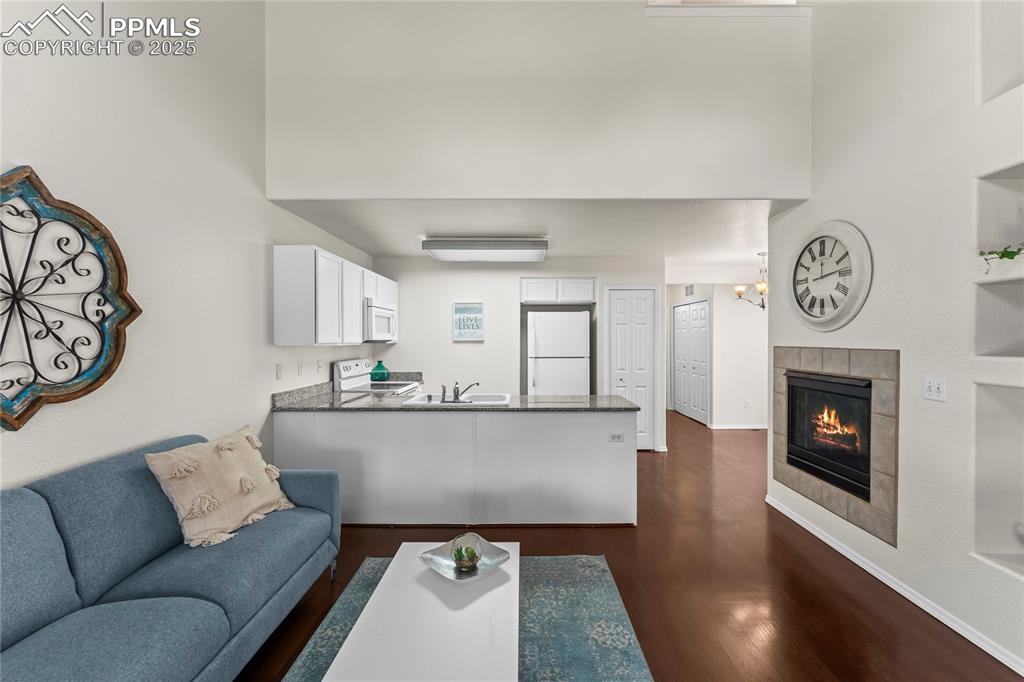 Image 5 of 22: Spacious main level, with open concept, living room, kitchen and dining are