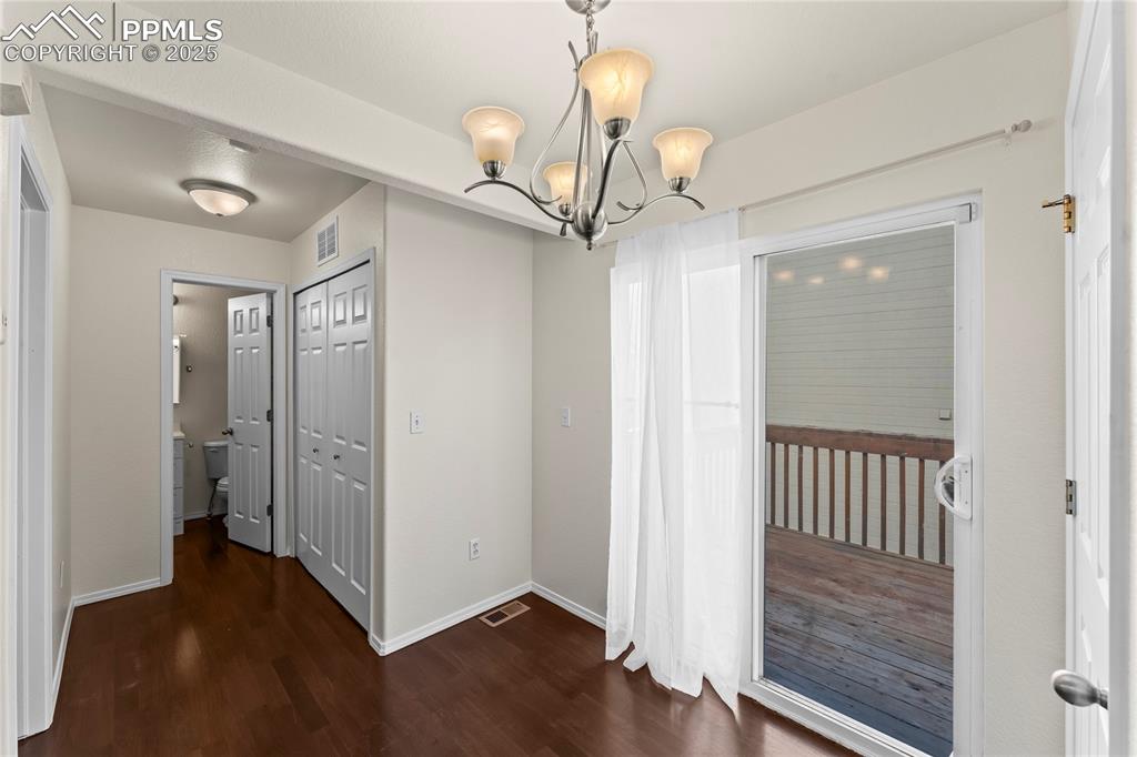 Image 9 of 22: Dining area with walkout to deck.