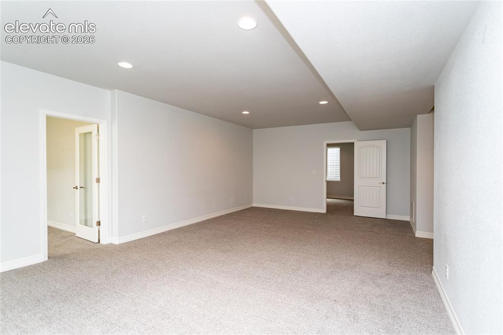 Image 30 of 45: Living area in basement