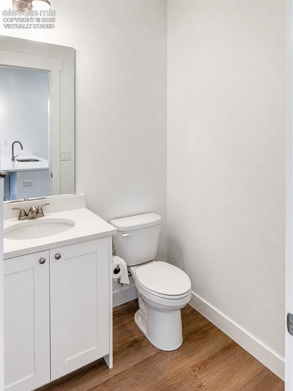 Image 19 of 19: Virtually Staged Bathroom featuring a white vanity with a quartz countertop