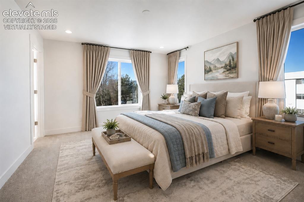 Image 8 of 19: Virtually Staged Spacious room featuring plush carpeting, dual windows with