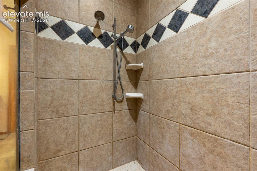 Image 24 of 50: Beautifully oversized tiled shower.