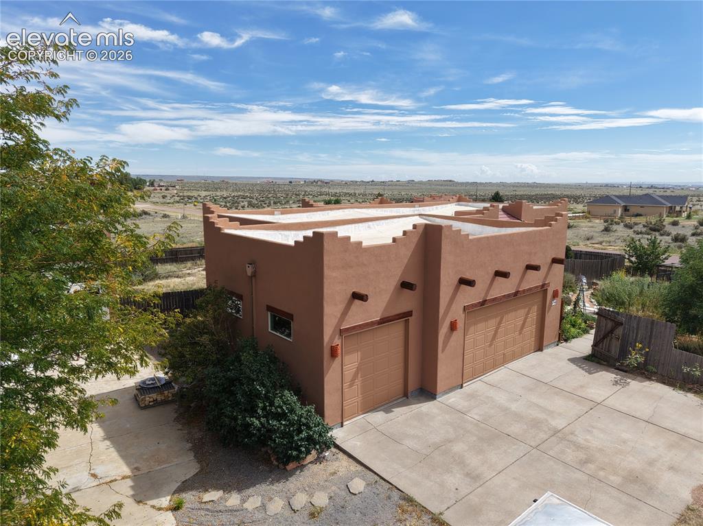 Image 3 of 50: 3 car garage Plus a RV Garage or room for 2-3 additional cars depending on 