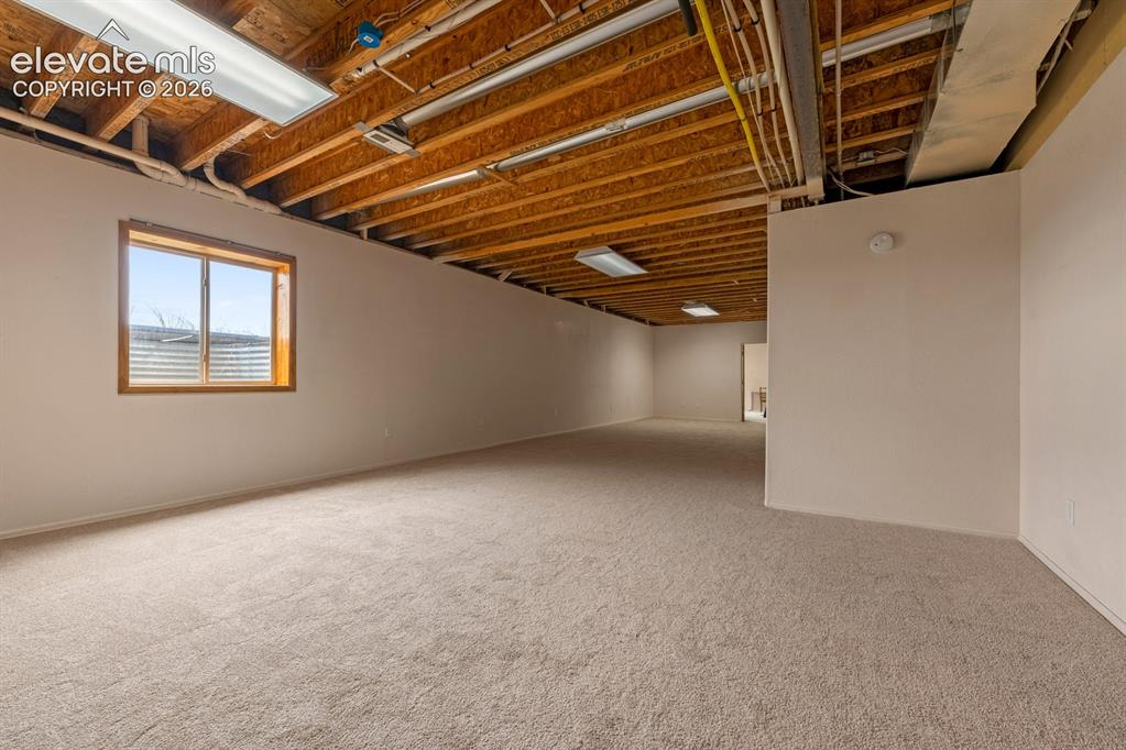 Image 32 of 50: Massive family room area 16 x 44 approx.  Brand new carpet.  