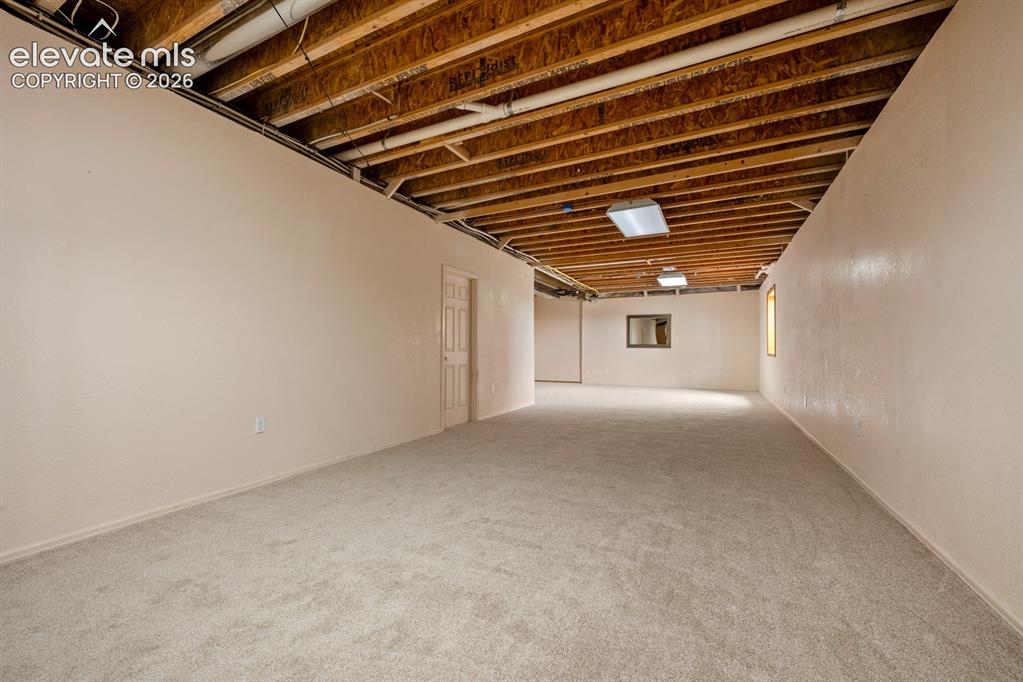 Image 33 of 50: Partially finished basement offers 2 additional bedrooms and a full bath.  