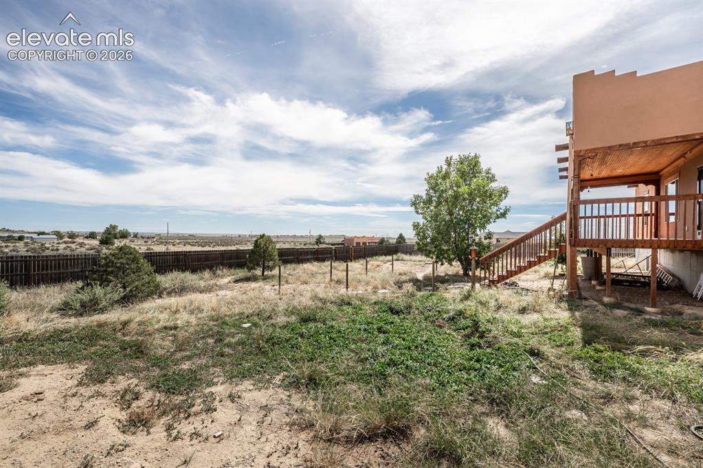 Image 40 of 50: A view facing South rare to have a property in Pueblo West with some trees.