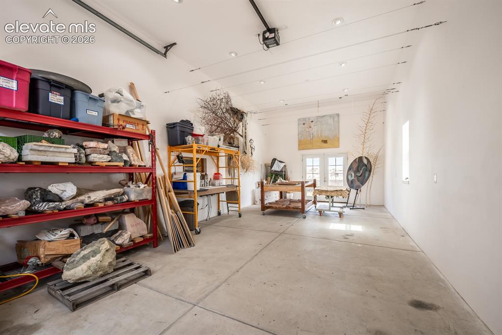 Image 44 of 50: Workshop, RV garage or art studio. Its finished with a swamp cooler and 22