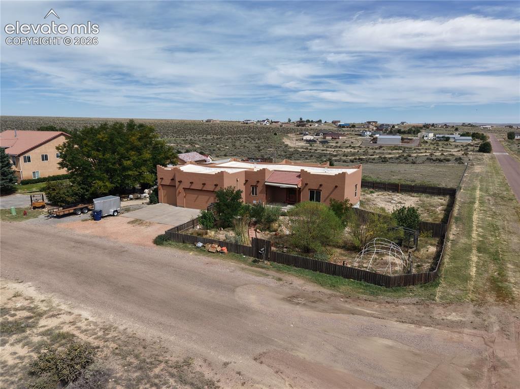 Image 48 of 50: 1.4 acres lot is fenced front and back and extends like a triangle behind t