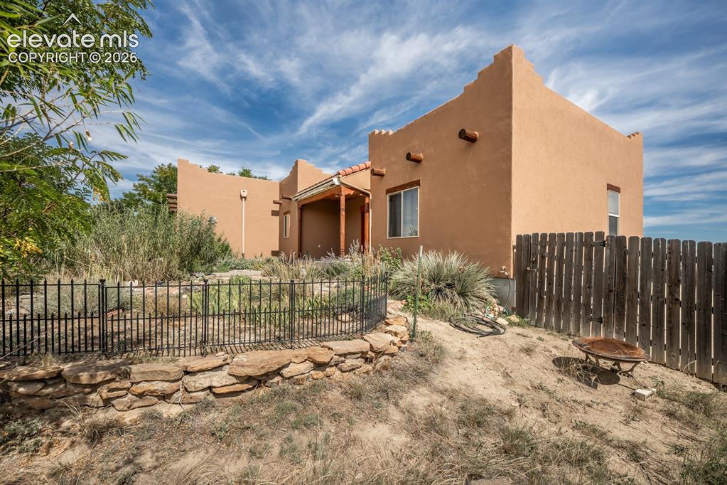 Image 5 of 50: Substainable living in these rustic oasis.  The garden utilizes partial irr