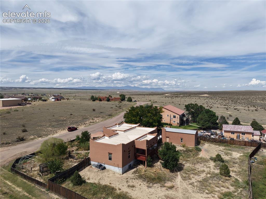 Image 50 of 50: View of the home and land facing NW towards the mountains. Home is peacefu
