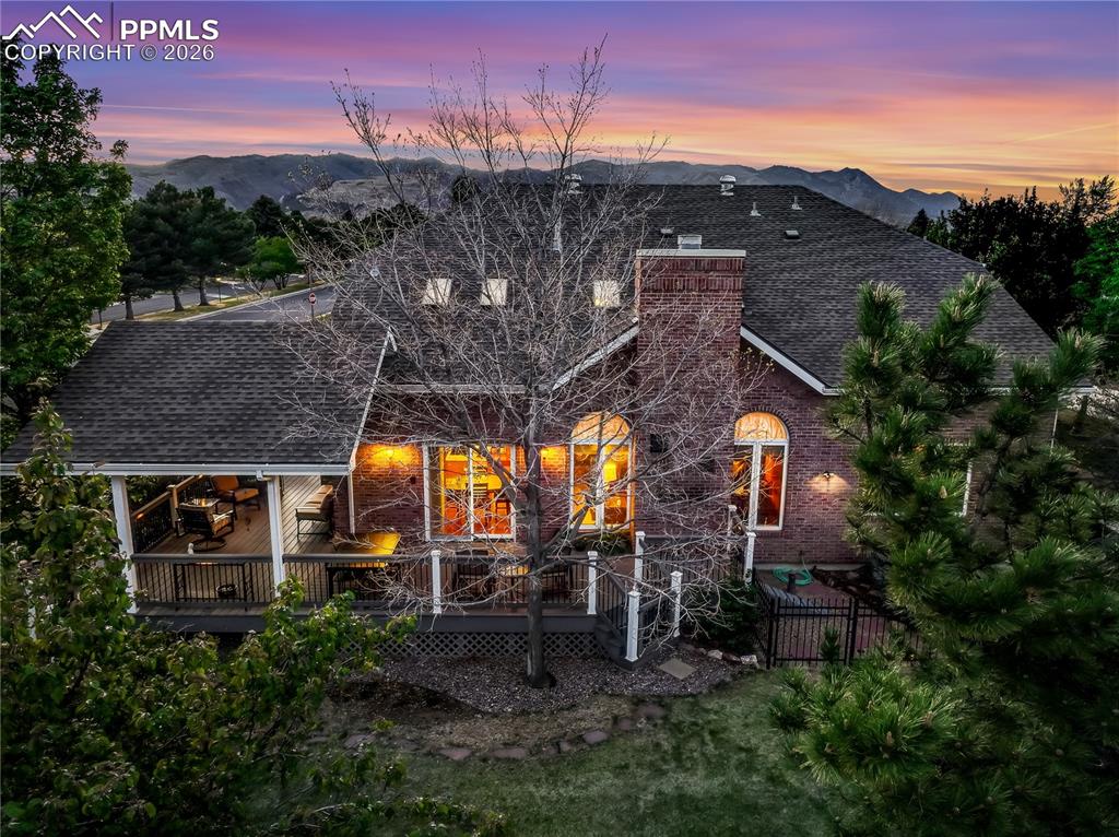 Image 2 of 46: Imagine a BBQ on this deck that wraps around the back and side of the home.
