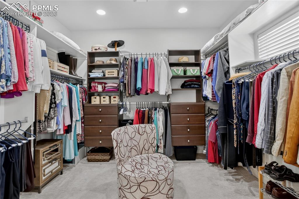 Image 25 of 46: Master closet has enviable built-ins