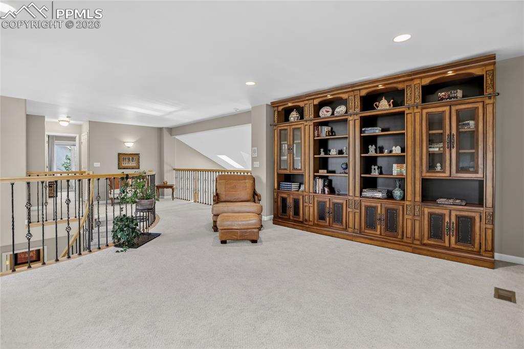 Image 29 of 46: Large loft overlooks the living room.
