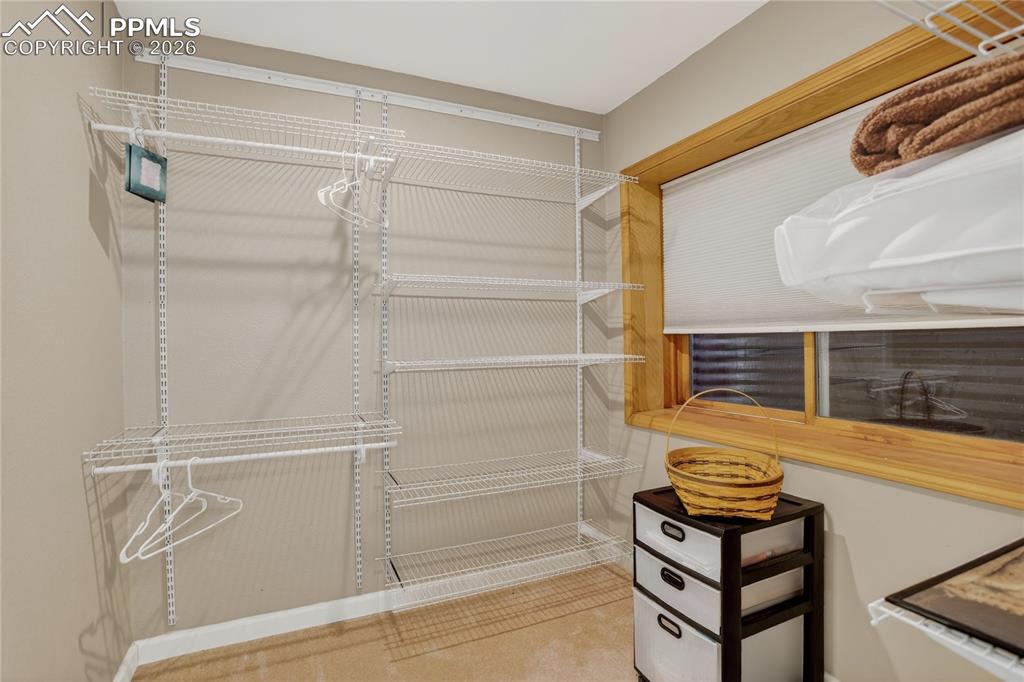 Image 36 of 46: Large walk-in closet inside the in-suite bedroom area downstairs.