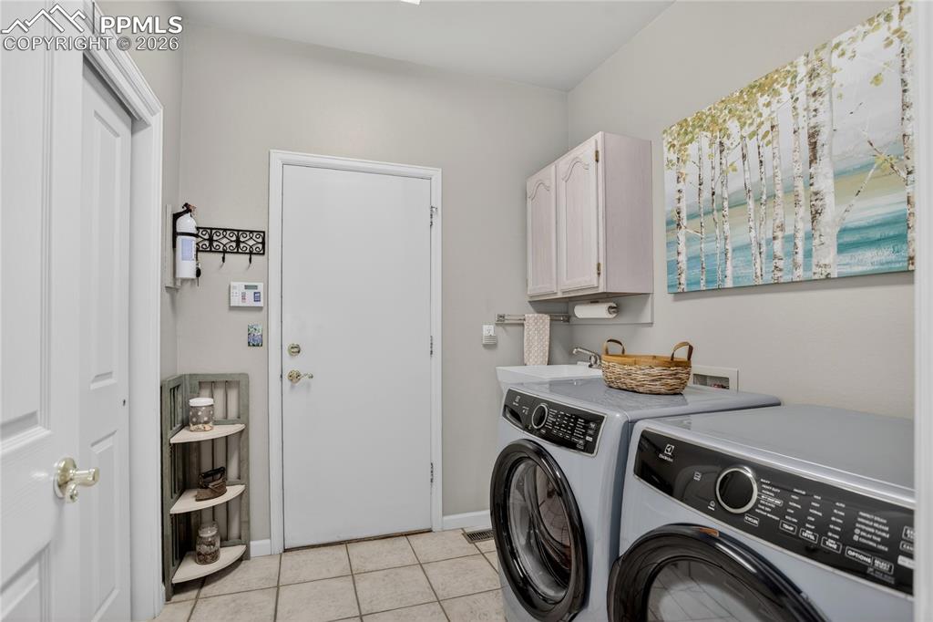 Image 6 of 46: main level laundry at garage entrance