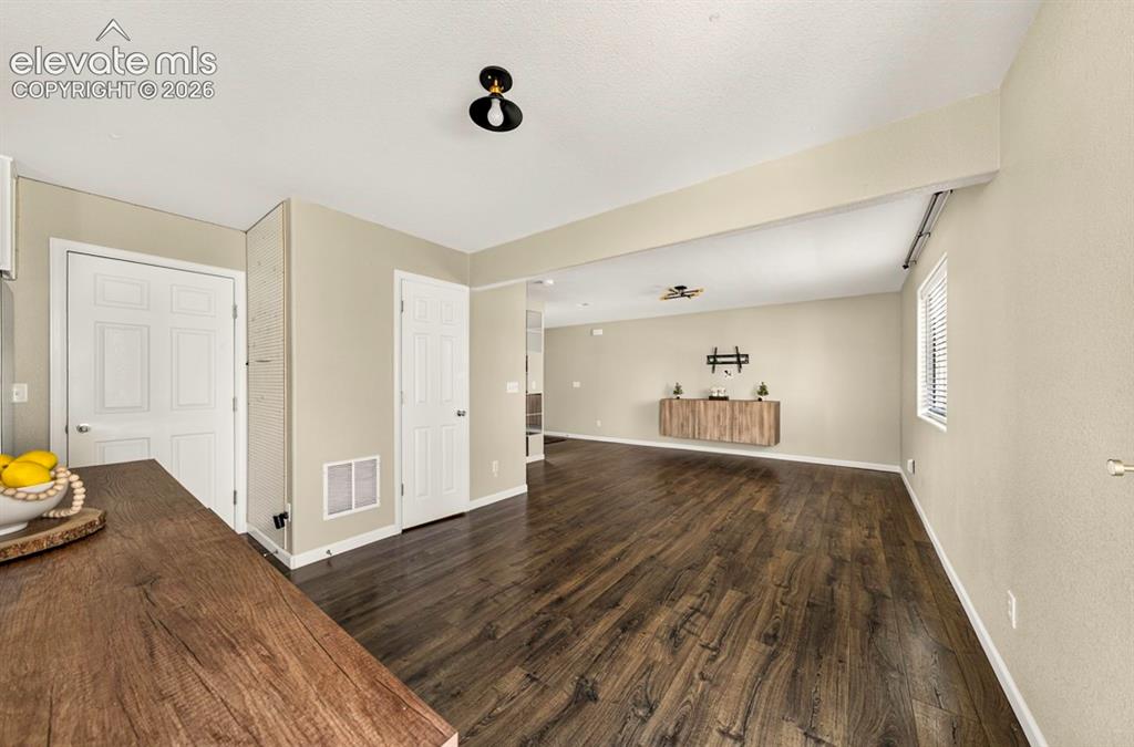 Image 13 of 36: dining/family room with built in entertainment center