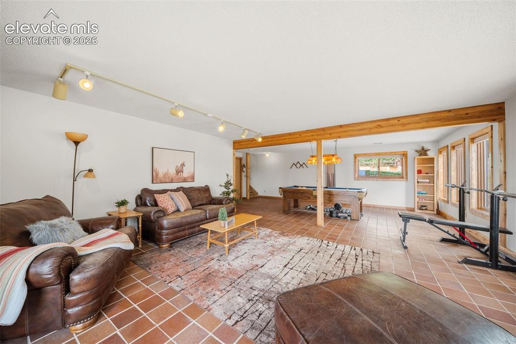 Image 16 of 39: Basement level family room