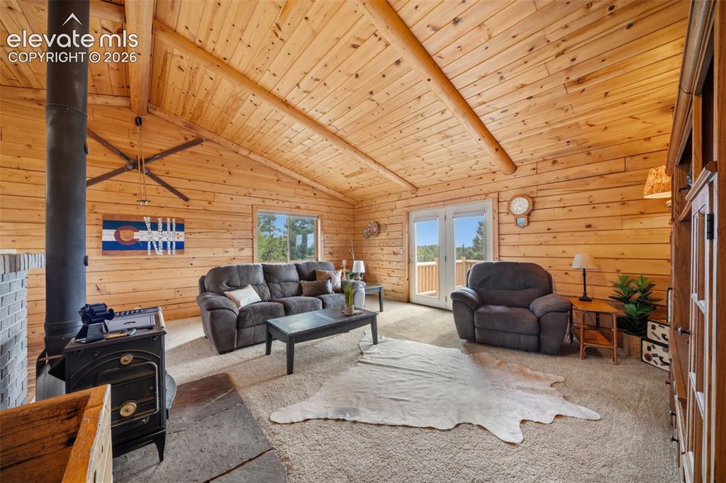 Image 5 of 39: Main level living room with walk out to deck