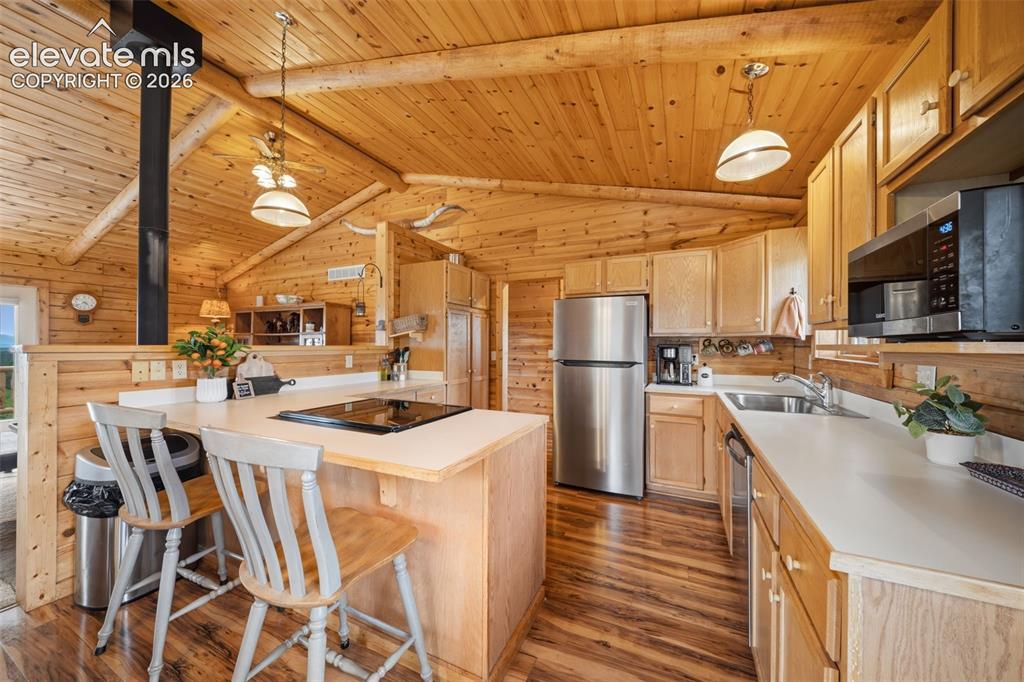 Image 8 of 39: Main level kitchen with newer stainless steel appliances (2025)