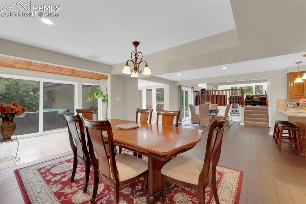 Image 11 of 43: Formal dining area off sunroom