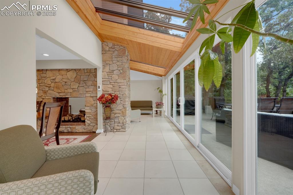 Image 15 of 43: Sunroom/solarium featuring a skylight