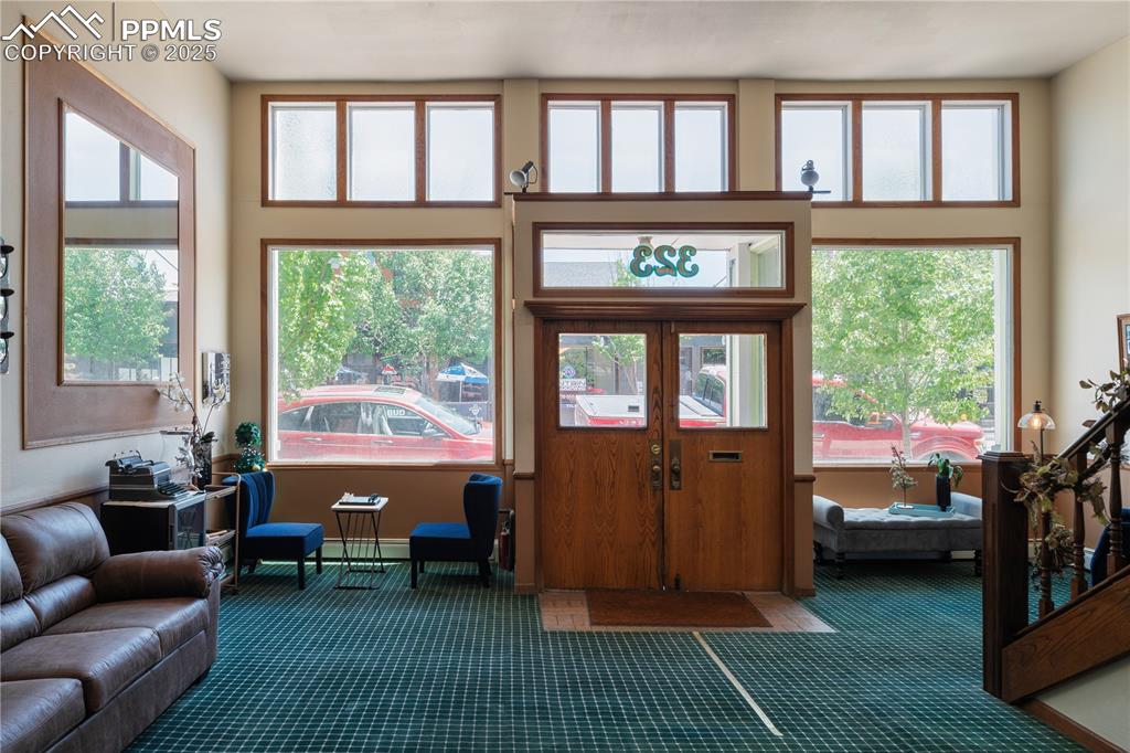 Image 10 of 31: Carpeted entrance foyer with baseboards