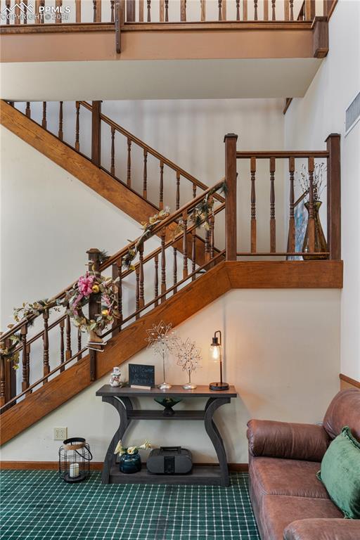 Image 11 of 31: Living room with a towering ceiling