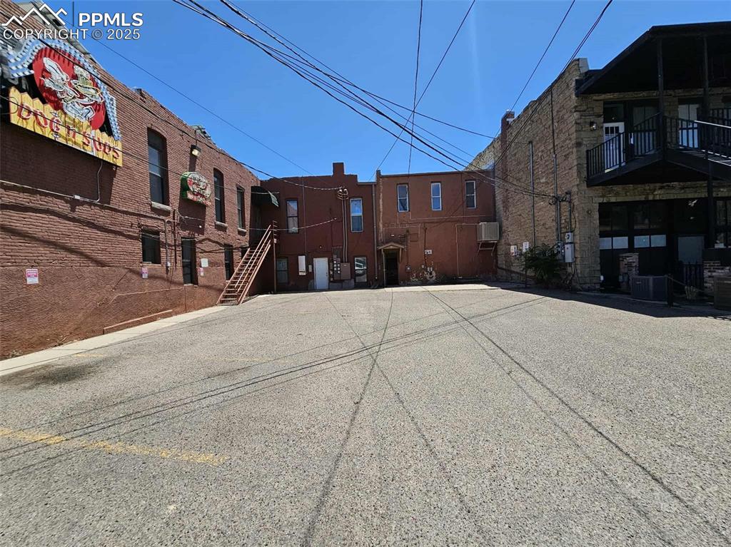 Image 30 of 31: View of asphalt road featuring stairway