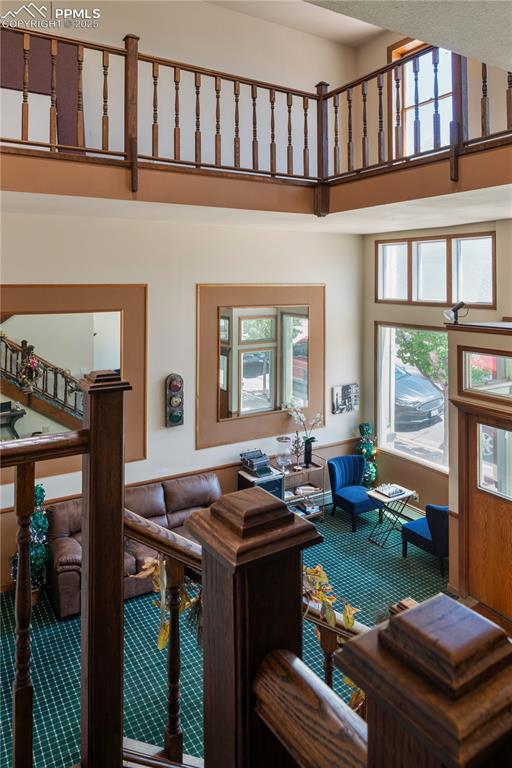 Image 6 of 31: Living area featuring a towering ceiling
