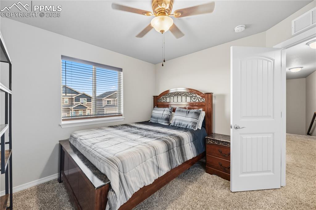 Image 22 of 33: Bedroom featuring carpet floors and ceiling fan